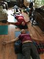 Chris and Brian in Shavasana hearing impaired sign language and cue yoga